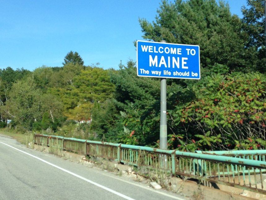 A sign welcomes visitors to Maine